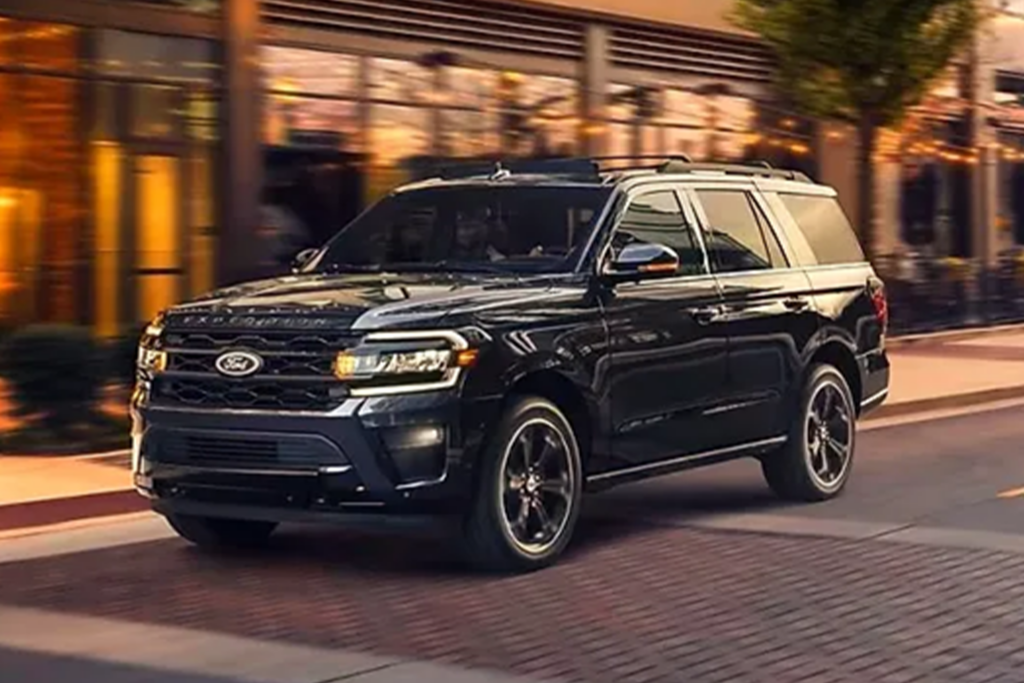 Ford Luxury SUV driving through downtown road