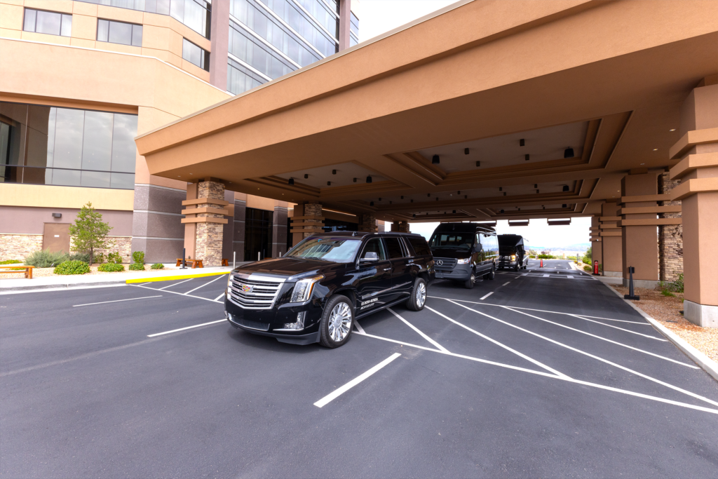 Star Luxury Transport vehicles parked under the porte cochere at Santa Ana Star Casino Hotel's hotel entrance