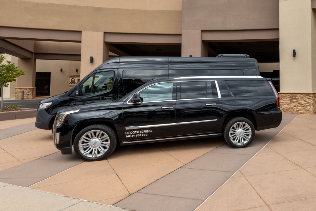 Profile shot of a Sprinter Van and Luxury SUV parked in front of Santa Ana Star Casino Hotel