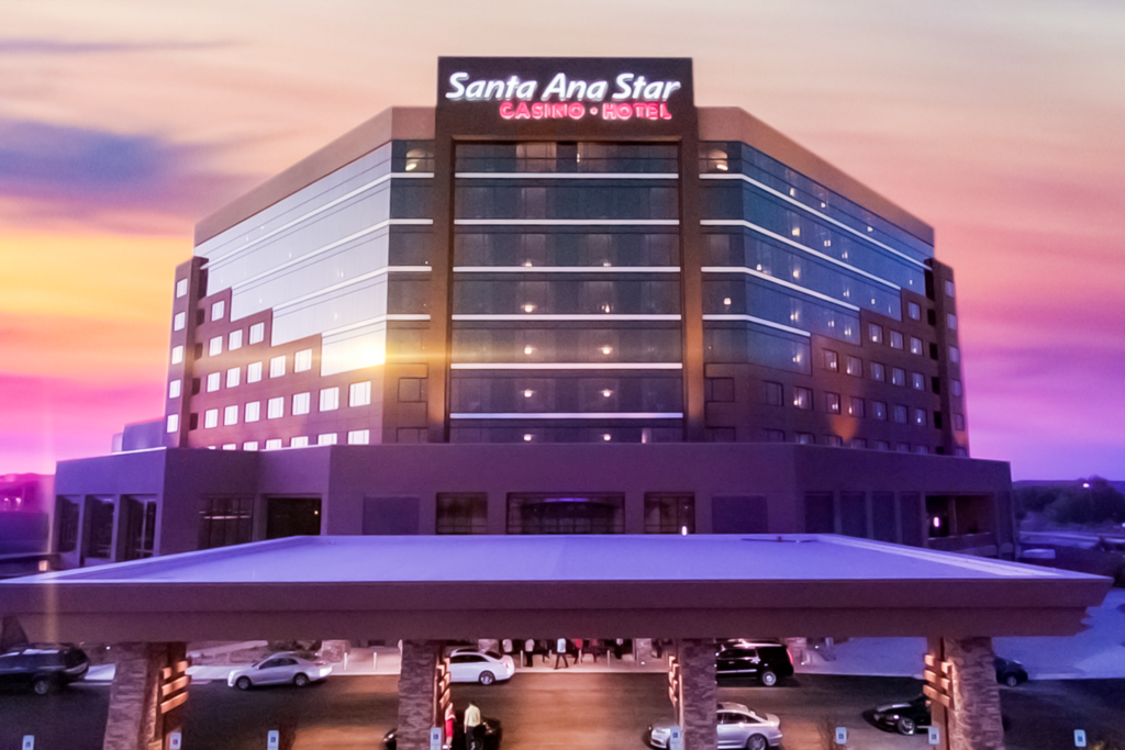 Santa Ana Star Casino Hotel at sunset with a purple and yellow sky
